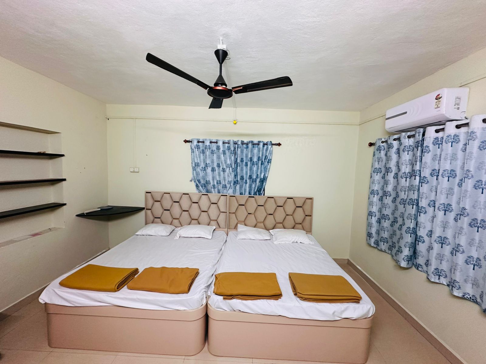 Clean and comfortable room interior at Shree Nivas Homestay